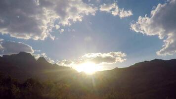 The sun shines brightly through the clouds in this photo video