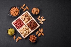 Wooden box with macadamia nuts, Brazil nuts photo