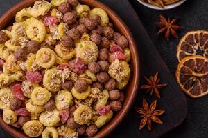 Flakes, chocolate balls and fruit for a breakfast photo