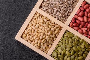 Peanuts and cedar nuts and sunflower and pumpkin seeds photo