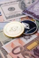 Metal ethereum on a background of paper banknotes photo