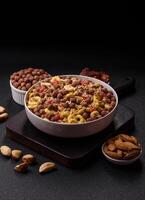 Flakes, chocolate balls and dried fruit for a breakfast photo