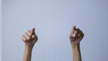 hands applauding and pointing fingers, making double thumbs up gesture on white isolated background. video