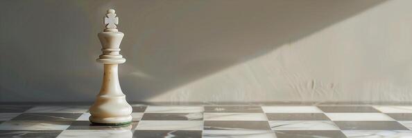 A white chess piece on a checkered floor photo