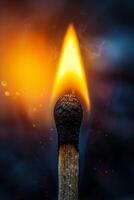 A matchstick with a flame coming out of it photo