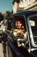 Classic Black Car with Bride Holding Flowers on Bleak Background photo