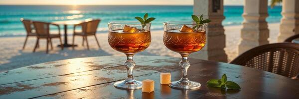 Cuban rum in glasses on a table against the backdrop of a stunning seascape of Cuba photo