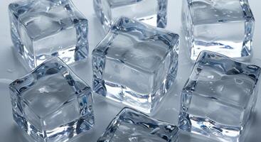 A group of ice cubes on a white surface photo