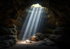 A cave with sunlight shining through it photo