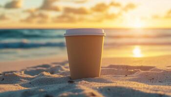 Paper cup disposable brand color mockup container on sand beach with sunset sky photo