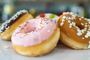 a selection of flavoured doughnuts bokeh image photo