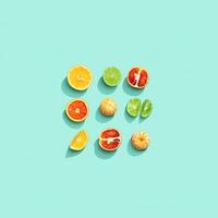 Citrus fruits as summer food layout, grapefruit, orange, tangerine, lemon, lime, red orange with shadow at sunlight on mint background. Healthy fresh fruit food concept. Square pattern photo