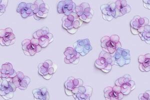 Natural Hydrangea flower, minimal floral pattern violet monochrome colored. Layout with fresh flowers, background. Spring holiday concept, for Mothers day, 8 March, Womens day. Flat lay photo