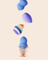 Beauty blender sponges blue color and striped bright in metal stand. Makeup cosmetic sponge, brush for face skin, facial applicator. Concept for salon fashion beauty makeup. photo