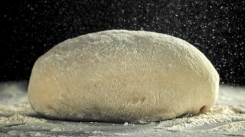 Flour falls on the dough. Filmed on a high-speed camera at 1000 fps. High quality FullHD footage video
