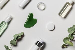 Gouache scrapes from green jade and moisturizing gel, floral decor. Natural gem stone massager photo