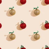 Happy holidays, Merry Christmas, New Year seamless pattern. Shiny red and golden Christmas balls or round baubles with shadows on pastel pink photo