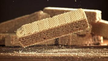 Waffles fall on a wooden table. Filmed on a high-speed camera at 1000 fps. High quality FullHD footage video