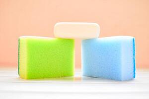 Universal kit for washing anything. Synthetic sponge and white soap photo