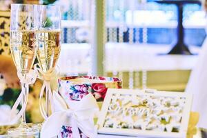 Two glasses of wine and wonderful flowers.Enjoyment wedding party event photo