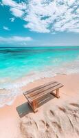 Wooden Bench Inviting Relaxation on a Serene Tropical Beach with Turquoise Water and Sky Views photo