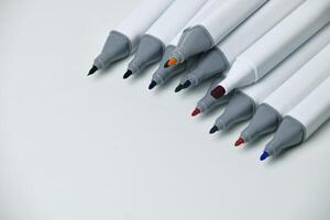 Top view of colorful markers with open caps photo