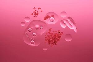 Different textures of cosmetics with a rose in the composition on a scarlet background. photo