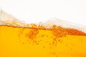 Close up bright orange Oil or beer splash texture and nature waves, Beautiful waves curve and little bubbles smooth for graphic design and background, Oil Bubbles, Soft beer bubbles, Sele photo