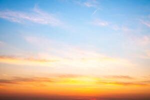 Beautiful , luxury soft gradient orange gold clouds and sunlight on the blue sky perfect for the background, take in evening,Twilight, Large size, high defini photo