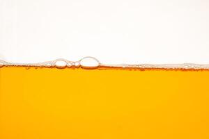 Close up bright orange Oil or beer splash texture and nature waves, Beautiful waves curve and little bubbles smooth for graphic design and background, Oil Bubbles, Soft beer bubbles, Selec photo