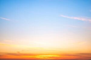 Beautiful , luxury soft gradient orange gold clouds and sunlight on the blue sky perfect for the background, take in evening,Twilight, Large size, high definit photo