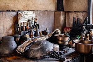 burned and damaged kitchen after a fire, showing scorched cookware, melted bottles, and blackened surfaces, highlighting the aftermath of destruction and fire damag photo
