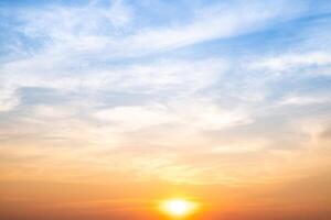 Beautiful , luxury soft gradient orange gold clouds and sunlight on the blue sky perfect for the background, take in evening,Twilight, Large size, high definition lands photo