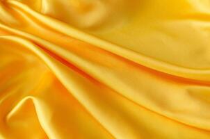 Top view of elegant yellow satin textile with shimmering highlights. Suitable for design and wallpaper background photo