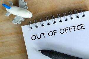 Top view of Out Of Off text. Out of office concept and getaway. photo