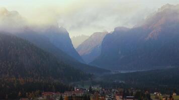 Aerial view of mountains near the town Dobbiaco and haze in Italian Dolomites video