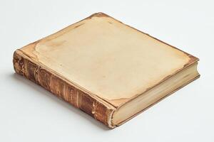 an old book on a white surface photo