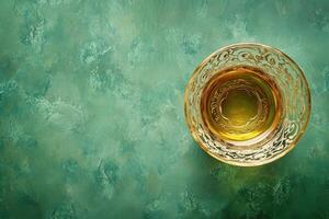 a glass of tea on a green background photo