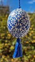 Ukrainian pysanka decorated with traditional patterns represents the beauty of Easter eggs in a vibrant spring setting photo