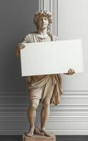 Classical male statue holding a blank white sign, perfect for adding your own text or image, in a sophisticated interior setting photo