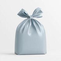 Light blue gift bag tied with bow on white background photo