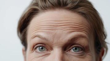 Mature man displaying prominent forehead wrinkles, emphasizing the visible effects of aging on skin texture and beauty photo