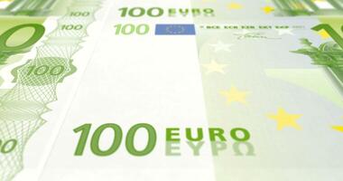 Series of banknotes of one hundred euro passing on screen. Loop video