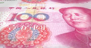 Banknotes of one hundred renminbi chinese rolling, cash money, loop. 4K Vertical video