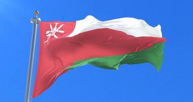Oman flag waving at wind with blue sky in slow, loop video