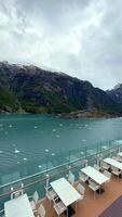 Cruise ship terrace overlooking glacial fjord with floating ice video