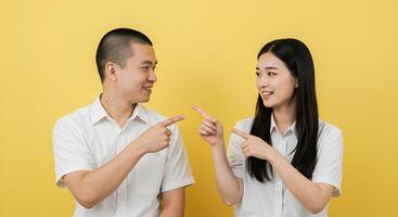 Smiling Couple Pointing Towards Something, Ready for a Discussion photo