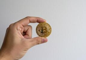 Bitcoin Coin on Wooden Surface with Bokeh Lights photo