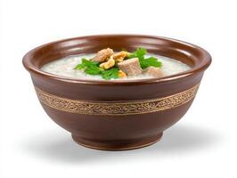A bowl of rice with meat and parsley photo