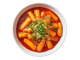 A bowl of carrots with sesame seeds on top photo